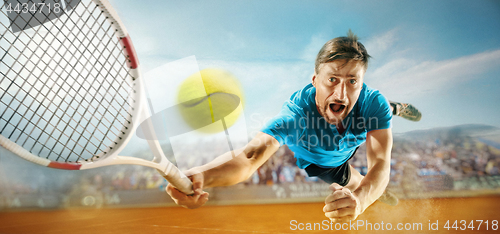 Image of The one jumping player, caucasian fit man, playing tennis on the earthen court with spectators