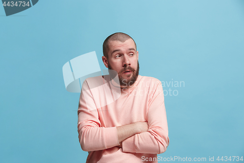 Image of Beautiful bored man bored isolated on blue background