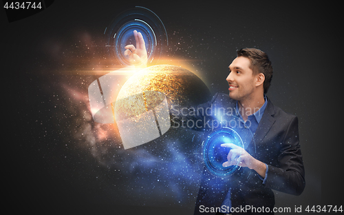 Image of businessman with virtual planet and space hologram