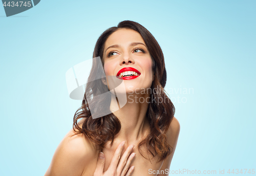 Image of beautiful smiling young woman with red lipstick