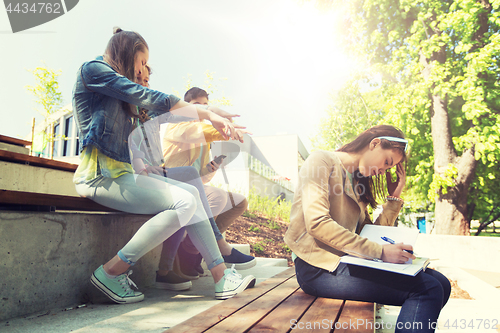 Image of student girl suffering of classmates mockery