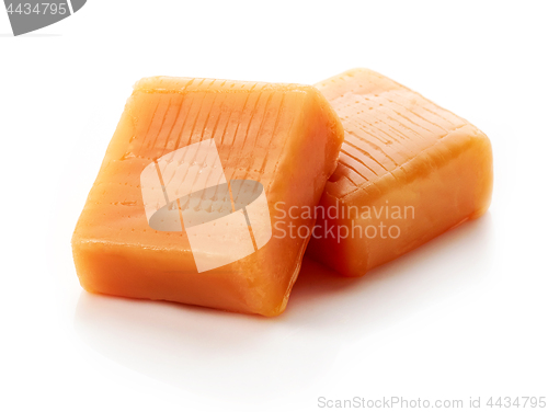 Image of caramel pieces on white background