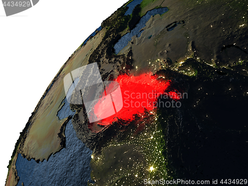 Image of Afghanistan in red on Earth at night