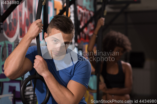 Image of Portrait of multiethnic couple  after workout at gym