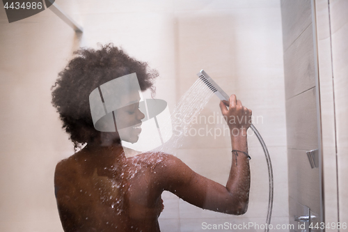 Image of African American woman in the shower