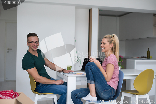 Image of Young couple moving in a new home