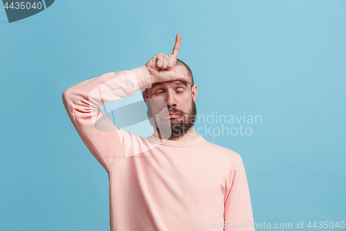 Image of Handsome man in stress isolated on blue