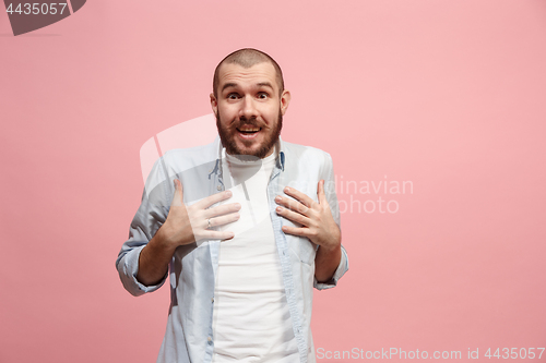 Image of Let me think. Doubtful pensive man with thoughtful expression making choice against pink background