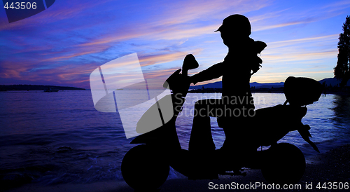 Image of scooter and sunset