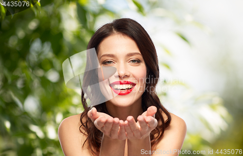 Image of beautiful smiling young woman with red lipstick