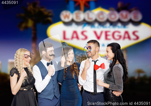 Image of happy friends with party props in las vegas
