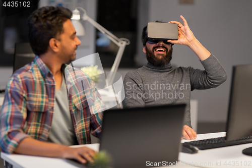 Image of creative man in virtual reality headset at office