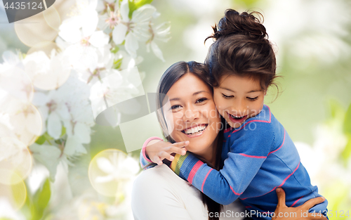 Image of happy mother and daughter hugging