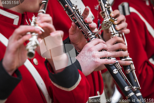 Image of Clarinet musicians in red uniform