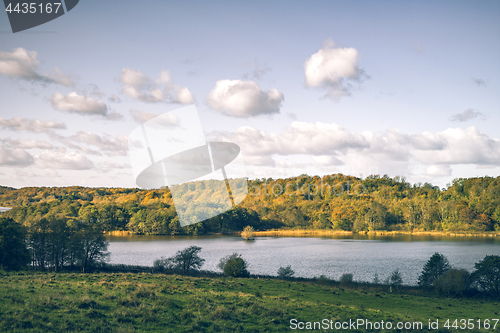 Image of River in a rural landscape with golden trees