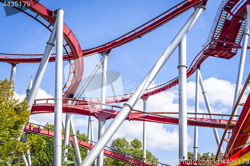 Image of Rollercoaster in red colors with curves and loops