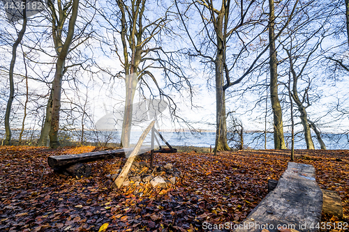 Image of Camp site with a fireplace and a bench