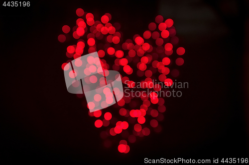 Image of Heart made of shiny bokeh lights in red color