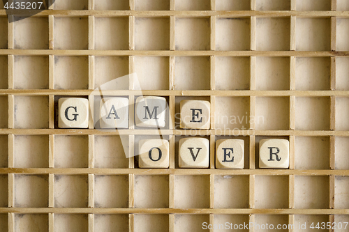 Image of Game over sign made of wooden dices