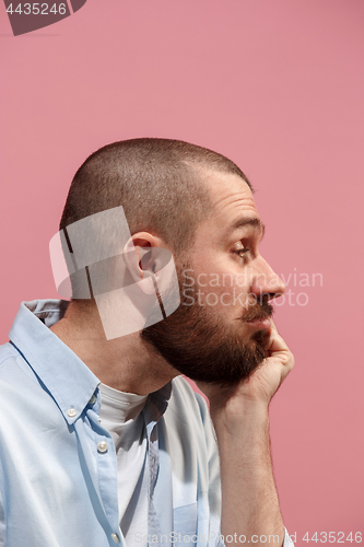 Image of Isolated on pink young casual man is boring at studio