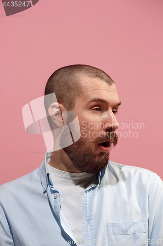 Image of Isolated on pink young casual man is boring at studio