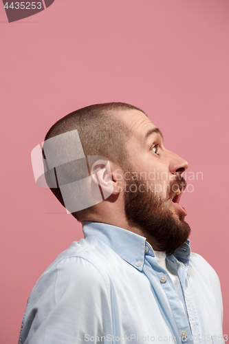 Image of Isolated on pink young casual man surprising at studio