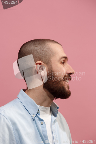 Image of Isolated on pink young casual man suspiciont at studio