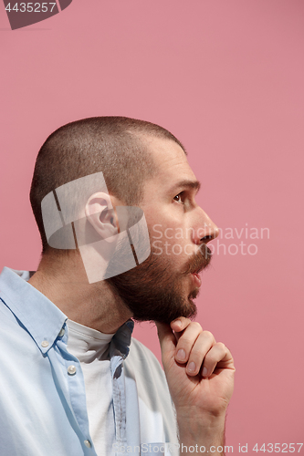 Image of Isolated on pink young casual man is gossiping at studio