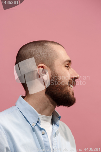 Image of Isolated on pink young casual man smiling at studio