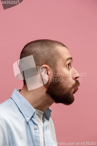 Image of Isolated on pink young casual man kissing at studio