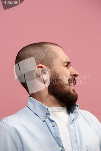 Image of Isolated on pink young casual man is afraid at studio