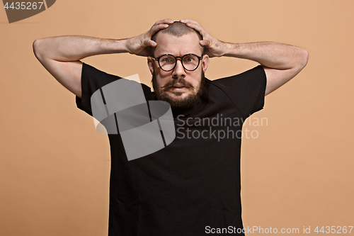 Image of Handsome man in stress isolated on pastel