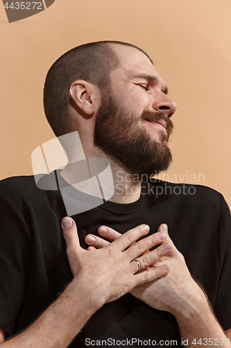 Image of Isolated on pastel young casual man smiling and enjoying at studio
