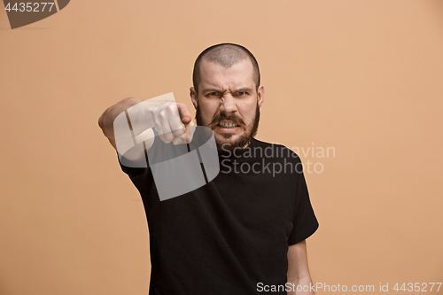 Image of The overbearing businessman point you and want you, half length closeup portrait on pastel background.
