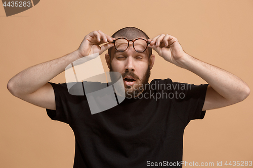 Image of Beautiful bored man bored isolated on pastel background