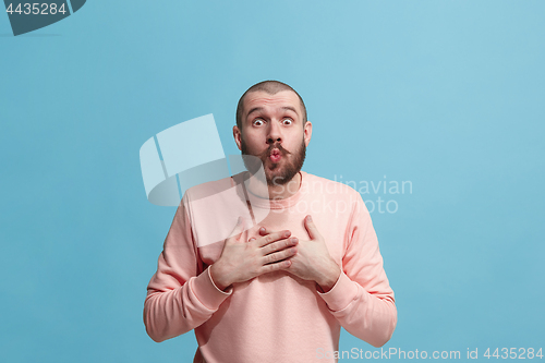 Image of Portrait of attractive man with kiss isolated over blue background