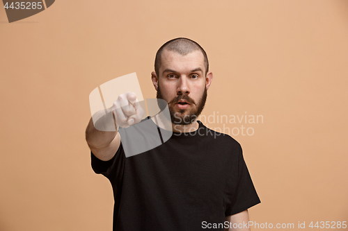Image of The overbearing businessman point you and want you, half length closeup portrait on pastel background.