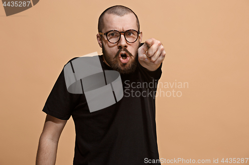 Image of The overbearing businessman point you and want you, half length closeup portrait on pastel background.