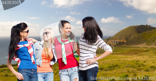 Image of teenage girls or young women over big sur coast