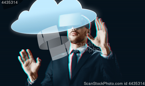 Image of businessman in virtual reality headset with cloud