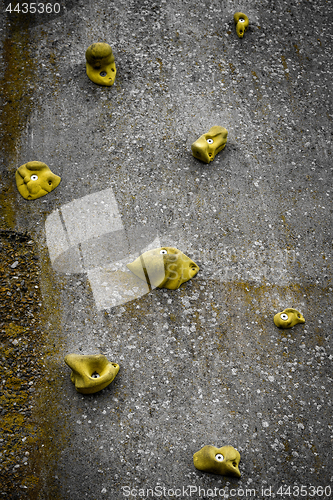 Image of Climbing wall with yellow handles