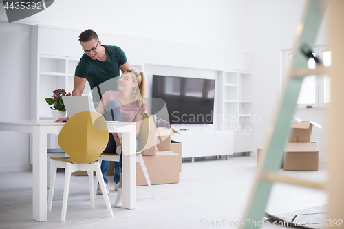 Image of Young couple moving in a new home