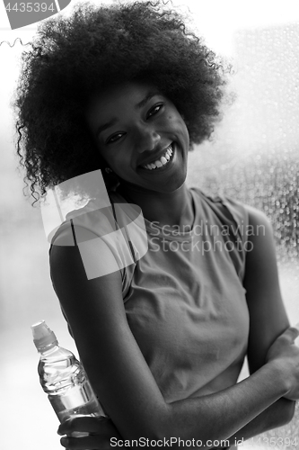 Image of portrait of young afro american woman in gym