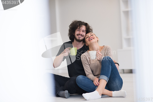 Image of young couple in their new home