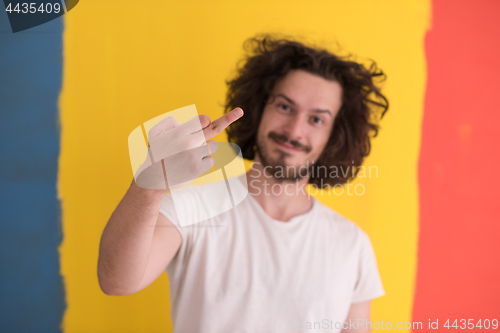 Image of young man with funny hair over color background