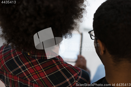 Image of african american couple using tablet at home