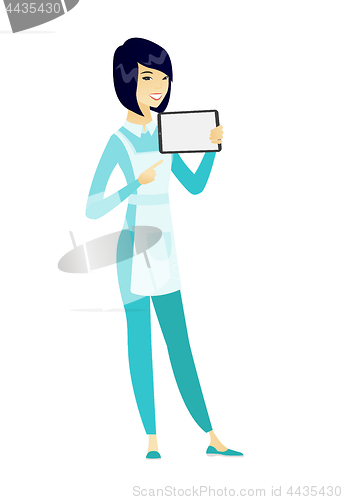 Image of Smiling cleaner holding tablet computer.