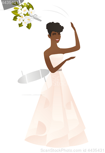 Image of African bride tossing a bouquet of flowers.