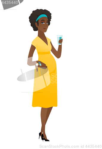 Image of Pregnant woman holding a glass of water and pills.