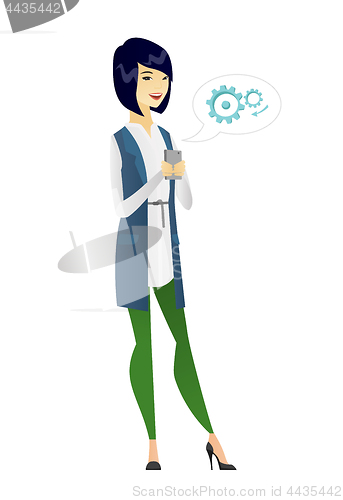 Image of Asian business woman holding a mobile phone.
